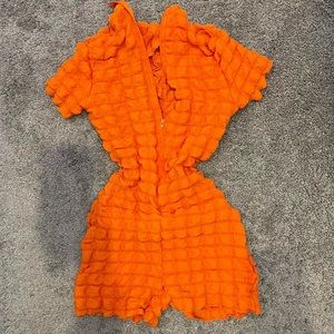 Orange bodycon high neck texture romper with zipper